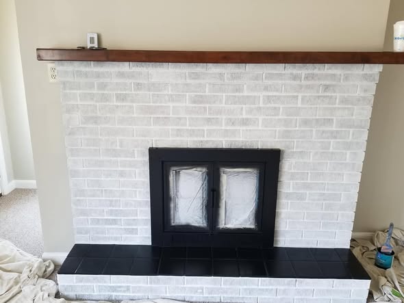 Interior painting feature fireplace wall black